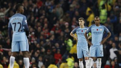Manchester City’s Kelechi Iheanacho, John Stones and Fernandinho looks dejected after Middlesbrough’s goal. Darren Staples / Reuters