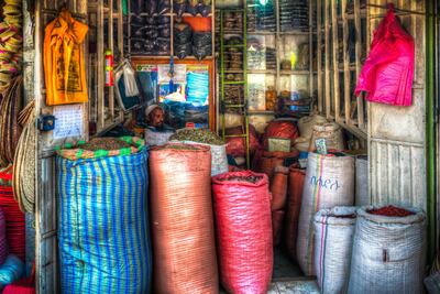 A shopkeeper sells spices in Merkato market. Getty