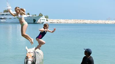 Jumping off a painted horse in pairs, a highlight of the camp
