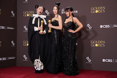 From left: Audrey Nuna, Ejae and Rei Ami pose with the Best Original Song - Motion Picture award for Golden from KPop Demon Hunters. Reuters