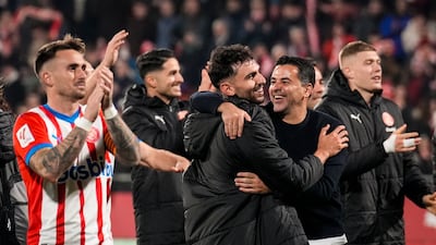 Girona´s head coach Michel (2R) celebrates with his players after winning the Spanish LaLiga soccer match between Girona FC and Atletico Madrid, in Girona, Spain, 03 January 2024. EPA / Siu Wu