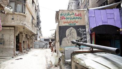 A general view shows graffiti on a wall at the entrance to the Palestinian Yarmouk refugee camp, south of Damascus, on April 9, 2015. Youssef Badawi/EPA