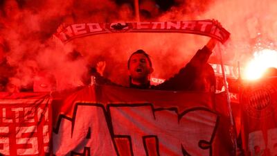 Bayern Munich fans light flares during the match against Hoffenheim. Reuters