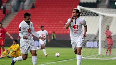 Nelson Valdez, right, may have signed off his Al Jazira career with two goals last night against Al Shaab. Christopher Pike / The National