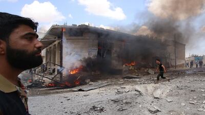 Syrian civilians react following an airstrike by Syrian regime forces in Maar Shurin on the outskirts of Maaret al-Numan in northwest Syria on July 16, 2019. AFP