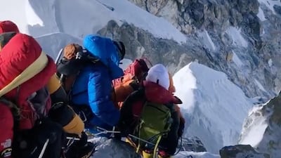 Climbers descend from the summit of Everest down the Hillary Step. At least 11 climbers have died so far this season. Reuters
