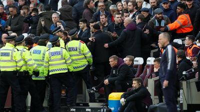 West Ham United fans react as police and stewards look on. David Klein / Reuters