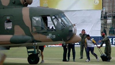 A Sri Lankan player boards the helicopter at Gaddafi stadium after the team bus was attacked in Lahore.