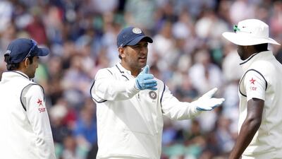 MS Dhoni, centre, called time on his Test career in December, shocking the cricket world. Ian Kington / AFP