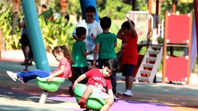 Young residents enjoy some fun in a play area at Zabeel Park on National Day. Pawan Singh / The National