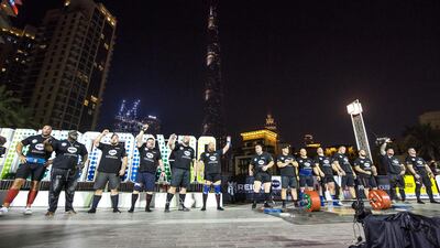 Participants take part in the World's Ultimate Deadlift on Thursday night in Burj Plaza, Dubai. All photos by Leslie Pableo for The National
