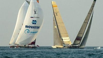 Emirates Team New Zealand and BMW Oracle Racing pass Synergy and All4One in Dubai yesterday.