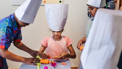 Mahnoor Dodhy takes part in a cooking lesson at the Kalimati Communication and Rehabilitation Centre. Alex Atack for The National