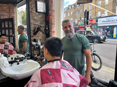 Eddie, a local barber, said Zack Polanski had come to his shop for haircuts but would not say whether he would vote for him. Photo: Lemma Shehadi
