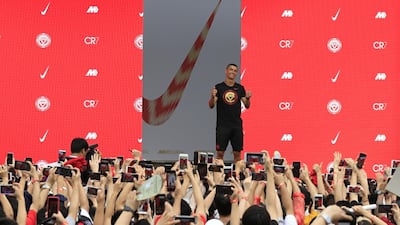 Ronaldo gestures as fans take photos of him. Reuters