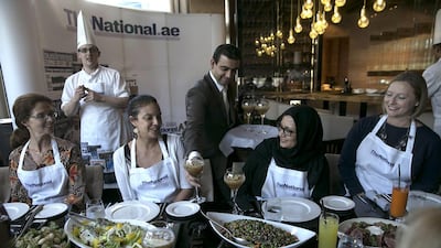 Guests and The National staff enjoy the food and the company after a morning spent cooking at the #healthyliving cooking experience. Silvia Razgova / The National