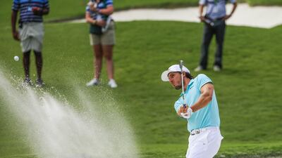 Jamie Lovemark of the US hits from a sand trap near the eighth green. Tannen Maury / EPA