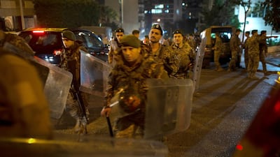Lebanese security forces move into position outside of the home of newly-assigned Lebanese Prime Minister, Hassan Diab. AP