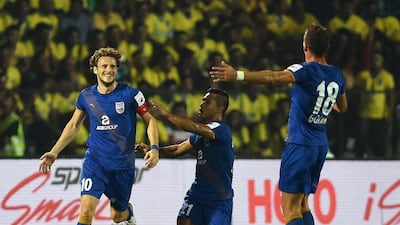 Mumbai City FC captain Diego Forlan, left, has played 10 matches in the Indian Super League so far and has enjoyed every moment of his time in India. Punit Paranjpe / AFP