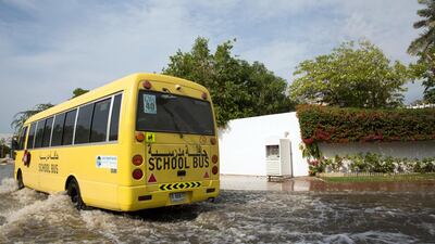 School Bus drives through a residential area in Jumeirah 1 as rainwater collects on the roads. Courtesy Tara Atkinson