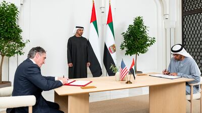 Sheikh Mohamed watches as Dr Al Jaber and Mr Burgum sign a preliminary agreement to accelerate collaboration in energy and artificial intelligence