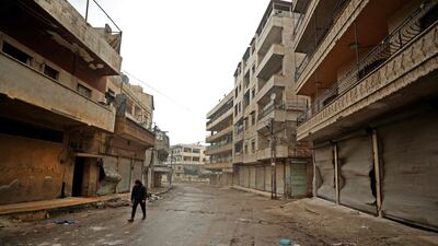 A Syrian man walks in a deserted street in the rebel-held town of Ariha in the northern countryside of Syria's Idlib province following an air strike by pro-regime forces. AFP