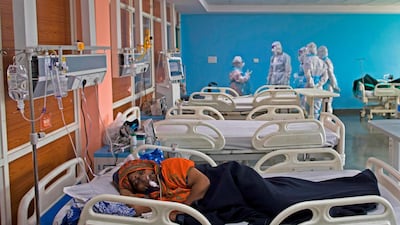 A Covid-19 patient lies on a bed at the Intensive Care Unit of the Sharda Hospital in Greater Noida, near India's capital New Delhi. Coronavirus cases in India passed one million on July 17, 2020 as authorities struggle to check the spread of the deadly pandemic across the world's second-most populous nation. AFP