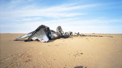 The remains of an aircraft on the desert floor, part of the series Dynamics of Dust by Phillippe Dudouit.