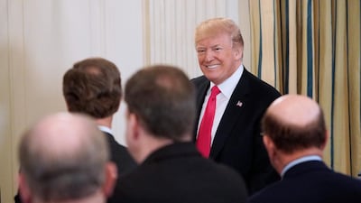 Donald Trump arrives for the 2018 White House business session with state governors in the dining Room of the White House. AFP/MANDEL NGAN