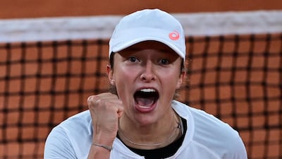 Poland's Iga Swiatek celebrates after beating Romania's Simona Halep to reach the French Open quarter-finals. AFP