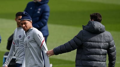 PSG manager Mauricio Pochettino with Kylian Mbappe. AFP