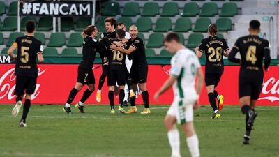 Riqui Puig celebrates with Antoine Griezmann, Martin Braithwaite and team mates after scoring. Getty