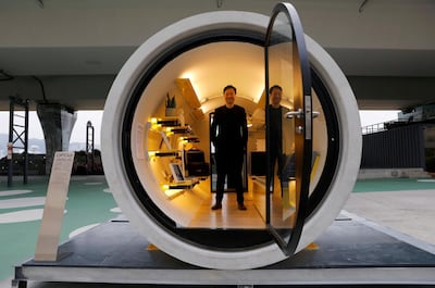 Architect James Law poses inside of his work - the Opod - a 120-square-ft giant water pipe designed as micro-housing in Hong Kong. Tyrone Siu / Reuters