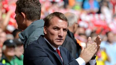 Liverpool manager Brendan Rodgers applauds during his side's Premier League season opening win over Southampton. Paul Ellis / AFP / August 17, 2014