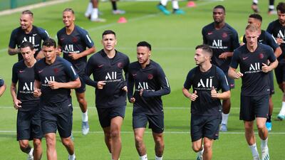 Neymar, centre, trains with his Paris Saint-Germain teammates but he looks to be heading for a move back to Spain. EPA