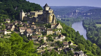Château de Castelnaud-la-Chapelle in Sarlat-la-Canéda. The hillsides of this area of the Dordogne region are filled with chateaux, ancient villages and lush gardens. Corbis Documentary / Getty Images / Phocal Media
