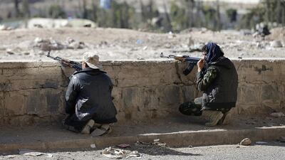 Houthi fighters take up position on a street during clashes near Yemen's presidential palace in Sanaa on January 19, 2015. Khaled Abdullah / Reuters