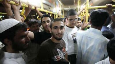 Standing room only on a packed bus.