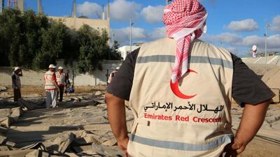 Emirates Red Crescent volunteers work at the site of Emirates field hospital in Deir al-Balah in central Gaza Strip.