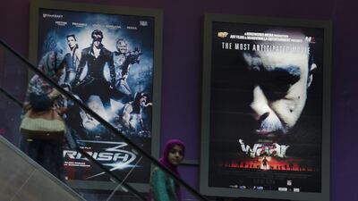 People leave an Islamabad cinema after watching the Pakistani movie Waar. BK Bangash / AP