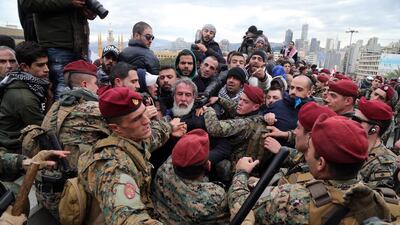 Lebanese soldiers clash with protesters near parliament in Beirut, Lebanon. Bloomberg