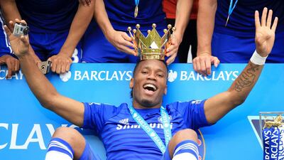 Chelsea's Didier Drogba celebrates with the lid of the Premier League trophy in 2015. PA