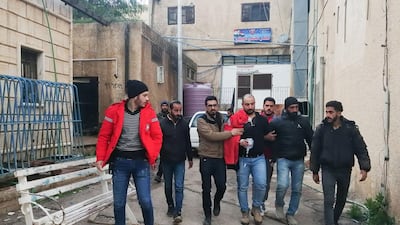 A handout picture obtained from the official Syrian Arab News Agency (SANA) on February 20, 2020 shows a recovering Syrian Oxfam aid volunteer, wounded the previous day in an attack in Syria's southern province of Daraa. AFP PHOTO / HO / SANA