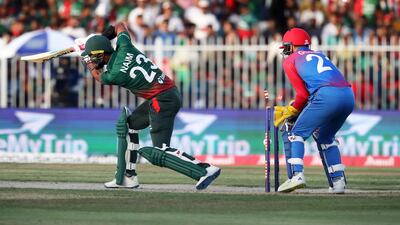 Bangladesh batter Mohammad Naim is bowled by Mujeeb Ur Rahman of Afghanistan.