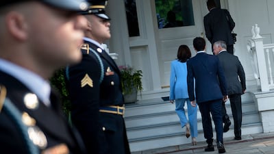 US Vice President Kamala Harris walks with Jordan's Crown Prince Hussein and Jordan's King Abdullah II to a meeting in Washington.