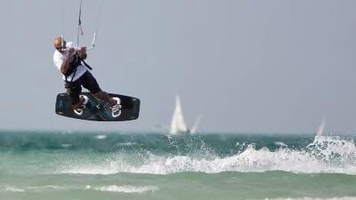 Emirati Saeed Al Dharif, 50, takes to the air during the kite surfing championships at the Al Gharbia Water Sports Festival on Saturday in Mirfa, Abu Dhabi. Silvia Razgova / The National