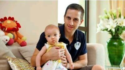 Robert Saunders with his 9-month-old Sofia. Mr Saunders’ wife, Natasha, says she will talk to her daughter about child abuse “when she is old enough to understand”.