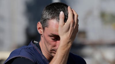 A member of a French rescue team searching for signs of life at the heavily damaged Mercure hotel in Palu. AP Photo