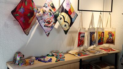 The artists' paintings decorate bags and cushions on display at the Mawaheb studio. Pawan Singh / The National