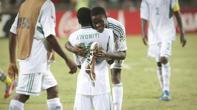 Taiwo Awoniyi is embraced by a team-mate after Nigeria beat Sweden 3-0 at the semi-finals of the Fifa Under-17 World Cup in Dubai on Tuesday. Razan Alzayani / The National
